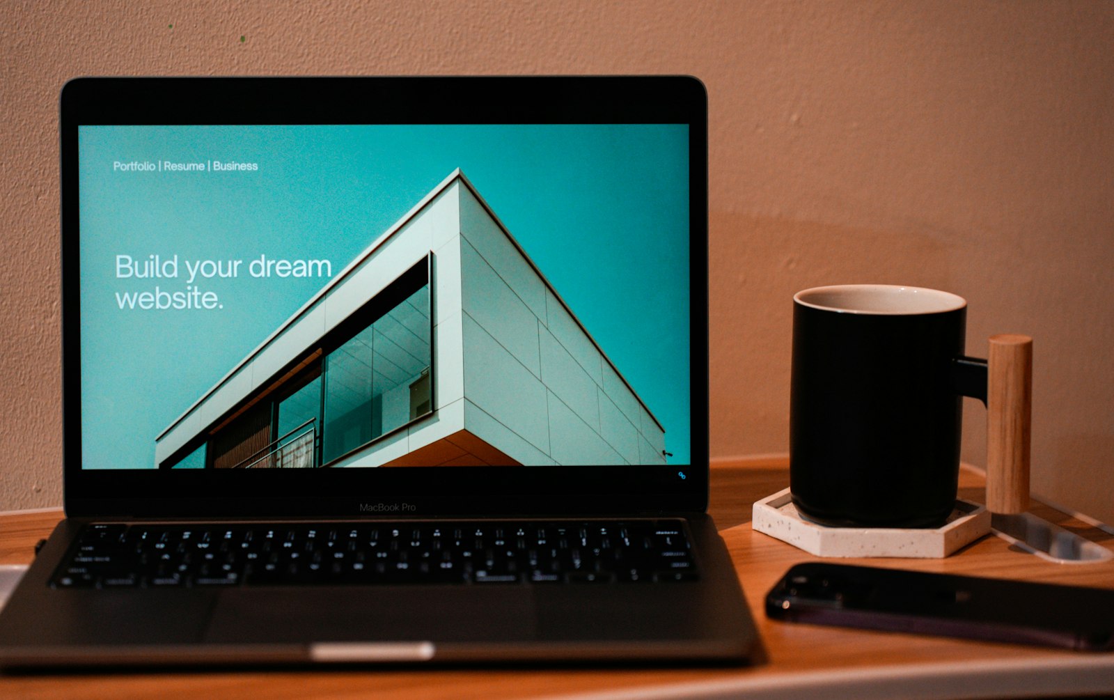 Laptop showing a website landing page being optimised for conversions